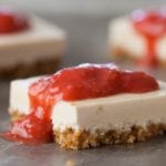Easy no-bake vegan cheesecake bars with brown rice cereal crust and strawberry topping